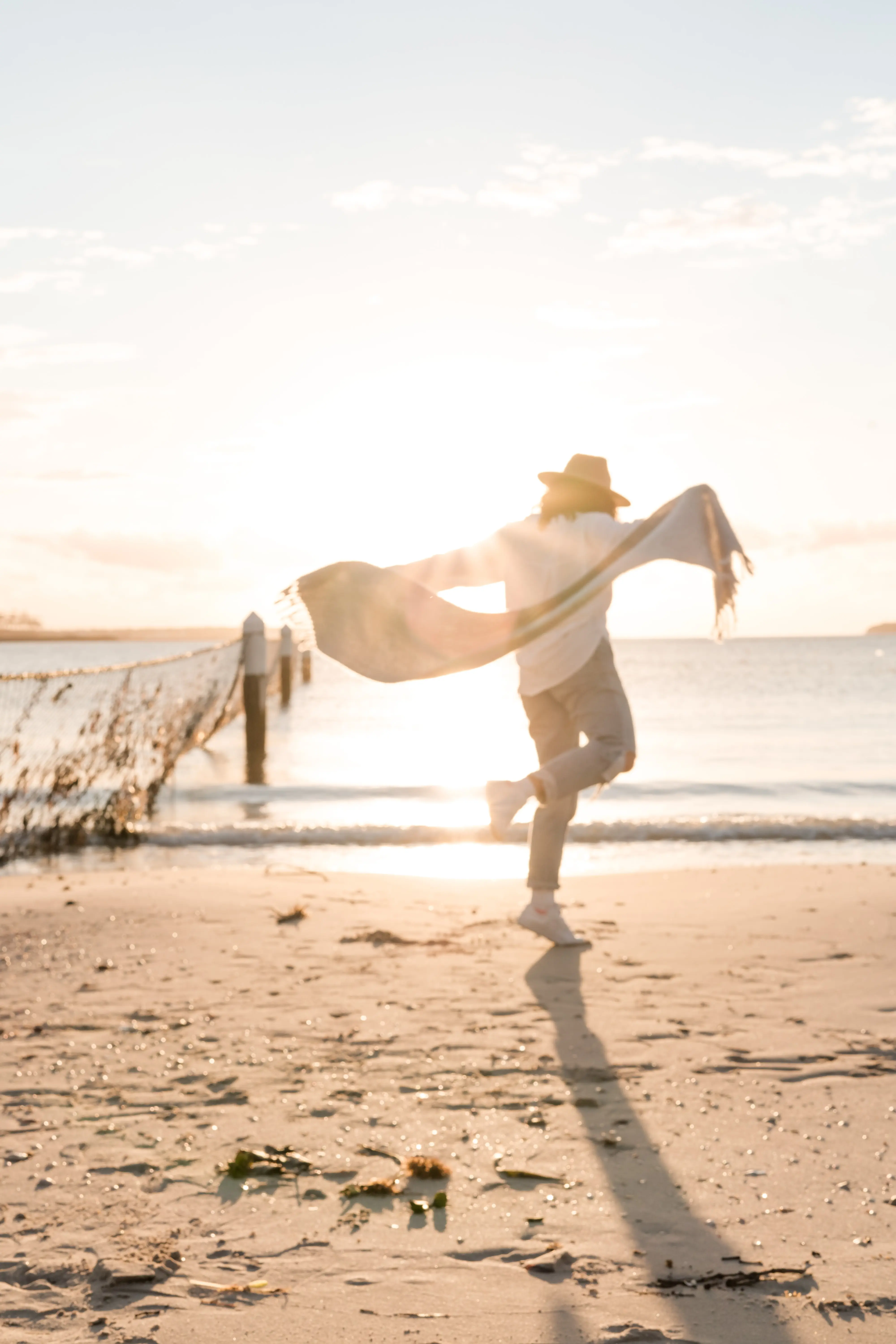 a man walking on the beach